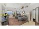 Bright living room with water views and comfortable seating at 4628 Club Dr # H201, Port Charlotte, FL 33953