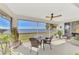 Relaxing screened balcony with water views and seating area at 4628 Club Dr # H201, Port Charlotte, FL 33953