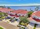 Luxury waterfront homes with red tile roofs and garages at 4732 Club Dr # 102, Port Charlotte, FL 33953