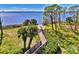 Wooden boardwalk leads to waterfront with scenic views at 4732 Club Dr # 102, Port Charlotte, FL 33953