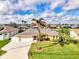 Aerial view of single-Gathering home with a large yard, pool, and canal access at 5231 Conner Ter, Port Charlotte, FL 33981