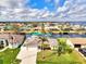 Aerial view of single Gathering home on waterfront with lush landscaping and canal access at 5231 Conner Ter, Port Charlotte, FL 33981