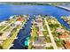 Aerial view of waterfront property with private pool and canal access at 5231 Conner Ter, Port Charlotte, FL 33981