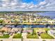 Aerial view of waterfront home community showcasing a single Gathering home at 5231 Conner Ter, Port Charlotte, FL 33981