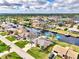 Aerial view of waterfront home community with lush landscaping and canal access at 5231 Conner Ter, Port Charlotte, FL 33981