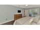 Bright bedroom with pool view, wood floors, and built-in dresser at 5231 Conner Ter, Port Charlotte, FL 33981