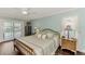 Spacious Primary bedroom with pool access and wood floors at 5231 Conner Ter, Port Charlotte, FL 33981