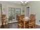 Casual dining area with sliding glass doors and wood floors at 5231 Conner Ter, Port Charlotte, FL 33981
