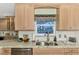 Modern kitchen features granite countertops and a double sink at 5231 Conner Ter, Port Charlotte, FL 33981