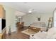 Open living room with hardwood floors, and a view of the dining area at 5231 Conner Ter, Port Charlotte, FL 33981
