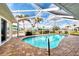 Relaxing pool and spa with covered patio and canal views at 5231 Conner Ter, Port Charlotte, FL 33981