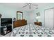 Spacious bedroom with a dresser and TV at 5725 Greenwood Ave # 6204, North Port, FL 34287