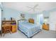 Comfortable bedroom with light blue walls, double bed, and built-in desk at 5725 Greenwood Ave # 6204, North Port, FL 34287