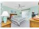 Charming bedroom with wooden furniture and a ceiling fan at 5725 Greenwood Ave # 6204, North Port, FL 34287