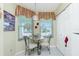 Bright breakfast nook with table and chairs near window at 5725 Greenwood Ave # 6204, North Port, FL 34287