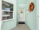 Condo entry with white door and autumnal wreath at 5725 Greenwood Ave # 6204, North Port, FL 34287