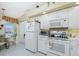 Kitchen area with white appliances and breakfast nook at 5725 Greenwood Ave # 6204, North Port, FL 34287