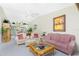 Living room features a comfy sofa and view into the dining area at 5725 Greenwood Ave # 6204, North Port, FL 34287