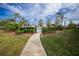 Pathway leading to a refreshing community pool at 5725 Greenwood Ave # 6204, North Port, FL 34287