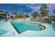 Community pool with lounge chairs and fenced-in area at 5725 Greenwood Ave # 6204, North Port, FL 34287