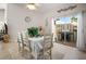 Dining room with patio access and seating for six at 601 Linden Dr, Englewood, FL 34223