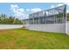 House with large backyard, grassy area and privacy fence at 6153 Pennell St, Englewood, FL 34224