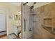 Walk-in shower with grab bars and tiled walls at 6153 Pennell St, Englewood, FL 34224