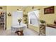 Bright dining area with a wooden table and a charming window treatment at 6153 Pennell St, Englewood, FL 34224