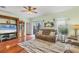 Living room with hardwood floors, comfortable seating, and access to a patio at 6153 Pennell St, Englewood, FL 34224