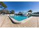 Inviting community pool with surrounding patio at 6283 Green View S Cir # 102, Sarasota, FL 34231