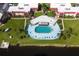 Community pool with surrounding patio and building view at 66 Boundary Blvd # 280, Rotonda West, FL 33947