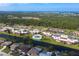 Aerial view of waterfront condos with community pool and lush landscaping at 66 Boundary Blvd # 280, Rotonda West, FL 33947