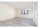 Bright bedroom with grey flooring and a window with exterior view at 66 Boundary Blvd # 280, Rotonda West, FL 33947