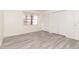 Simple bedroom featuring grey flooring and a window at 66 Boundary Blvd # 280, Rotonda West, FL 33947