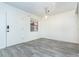 Simple dining area with gray wood-look floors at 66 Boundary Blvd # 280, Rotonda West, FL 33947