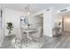 Dining area with round table and four chairs at 66 Boundary Blvd # 280, Rotonda West, FL 33947