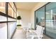 Relaxing enclosed balcony with comfortable seating and outdoor access at 66 Boundary Blvd # 280, Rotonda West, FL 33947
