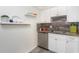 White cabinets, stainless steel appliances, and stylish countertops at 66 Boundary Blvd # 280, Rotonda West, FL 33947