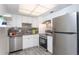 Modern kitchen with stainless steel appliances at 66 Boundary Blvd # 280, Rotonda West, FL 33947