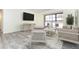Living room with comfy seating and sliding glass doors at 66 Boundary Blvd # 280, Rotonda West, FL 33947