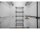 Closet with wire shelving and hanging rods at 660 Linden Dr, Englewood, FL 34223