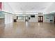 Large community room with kitchen and fireplace at 660 Linden Dr, Englewood, FL 34223