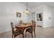 Bright dining room with a wood table, chairs, and built-in cabinet at 660 Linden Dr, Englewood, FL 34223