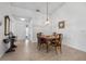 Classic dining room with wood table and chairs, and a chandelier at 660 Linden Dr, Englewood, FL 34223