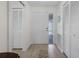 Light and airy entryway with built-in storage and wood-look flooring at 660 Linden Dr, Englewood, FL 34223