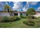 Home exterior with manicured landscaping at 660 Linden Dr, Englewood, FL 34223