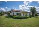 Updated home with landscaped yard and lush lawn at 660 Linden Dr, Englewood, FL 34223