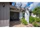 Inviting front entrance with a pergola and nicely landscaped area at 660 Linden Dr, Englewood, FL 34223