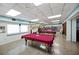 Game room featuring billiard tables and bookshelves at 660 Linden Dr, Englewood, FL 34223