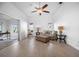 Relaxing living room with light flooring, a sofa, and sliding glass doors at 660 Linden Dr, Englewood, FL 34223
